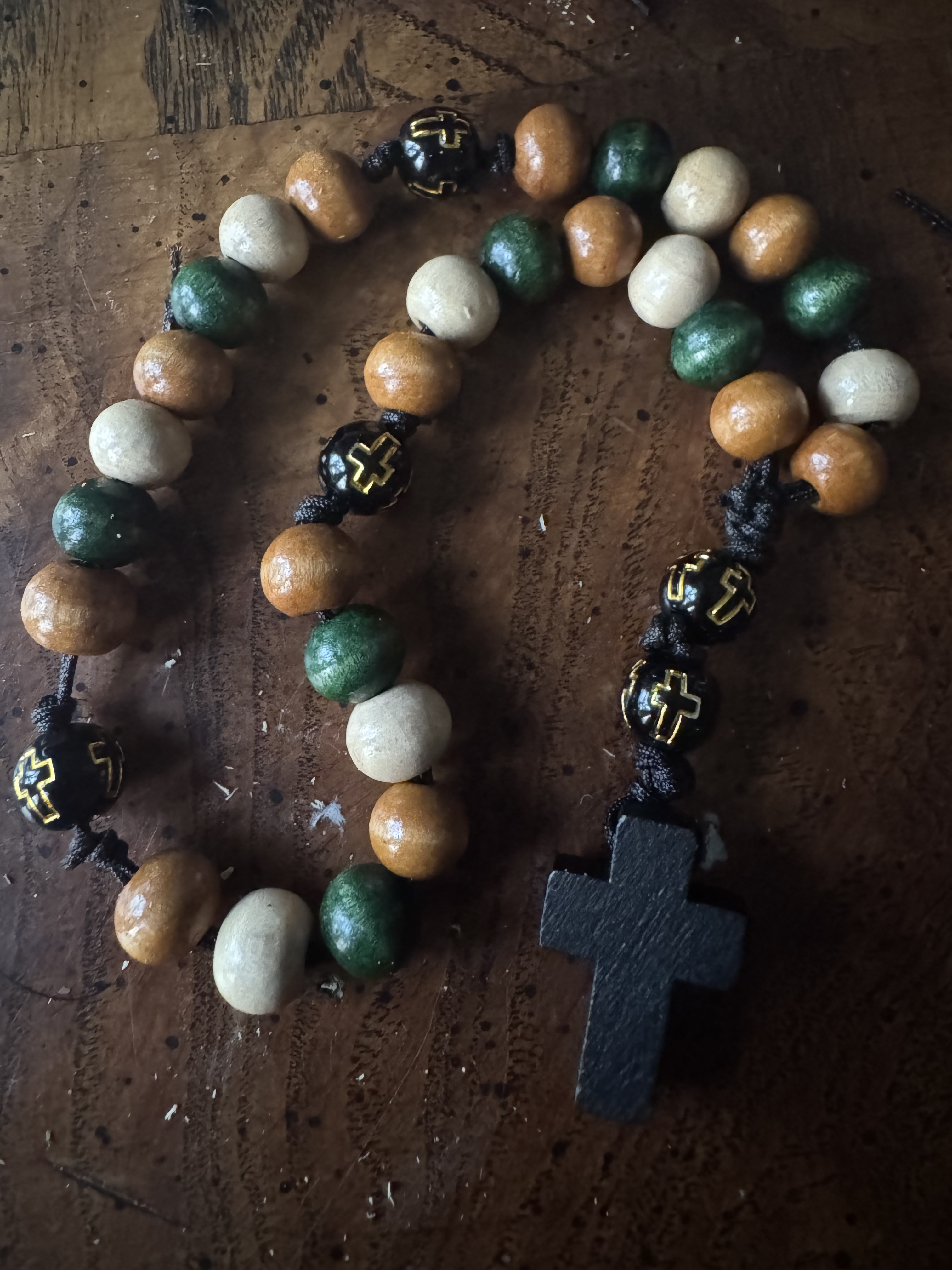 Green, natural wood, and black handmade Anglican rosary with black wooden cross